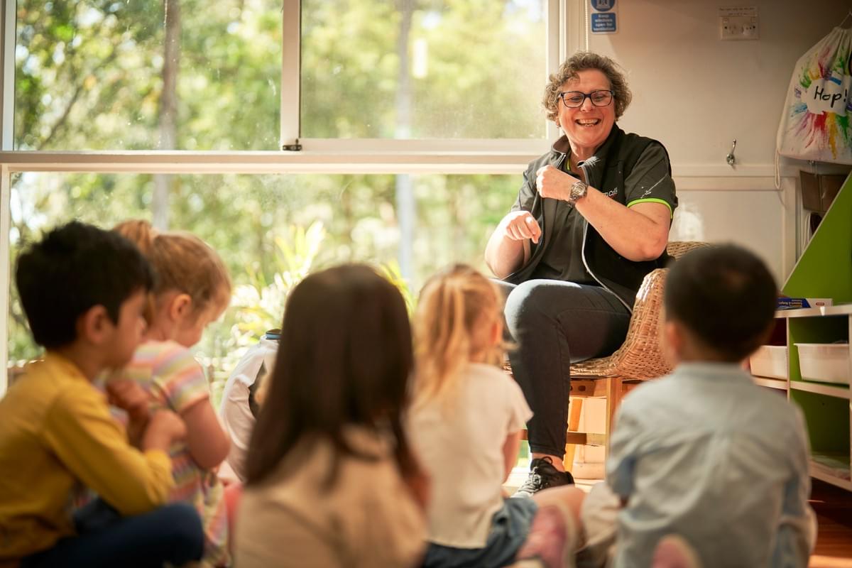 Educator leading a group time with children Educator leading a group time with children