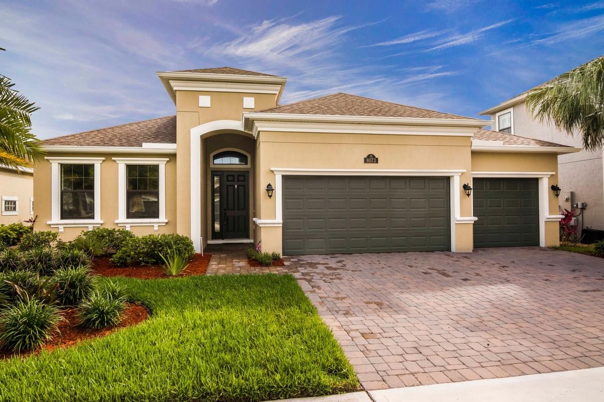 single story home with yellow color and brown accents.  single story home with yellow color and brown accents.