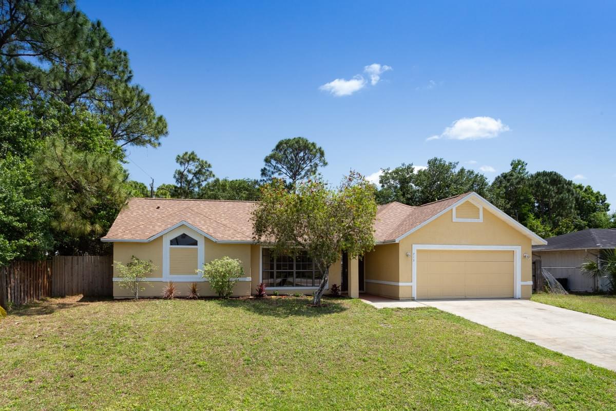 Front photo of yellow painted home. Front photo of yellow painted home.