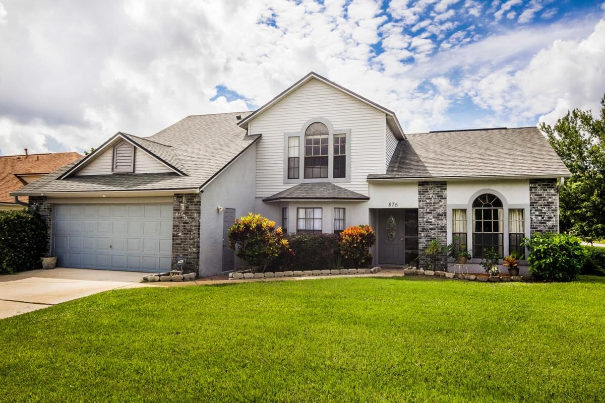 2 story home with gray paint and stone accents 2 story home with gray paint and stone accents