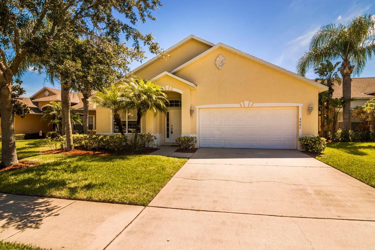 Yellow colored single story home Yellow colored single story home