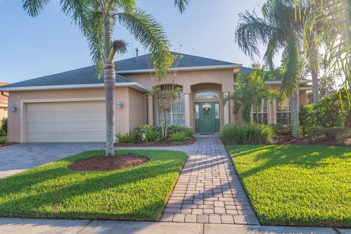 single story brown and tan home with palms in front single story brown and tan home with palms in front