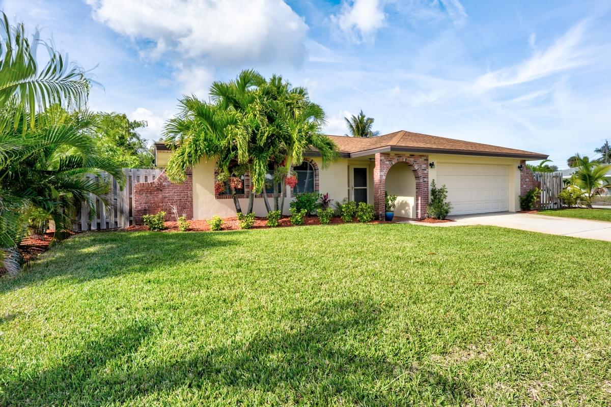 1970s style home with brick and tan stucco 1970s style home with brick and tan stucco
