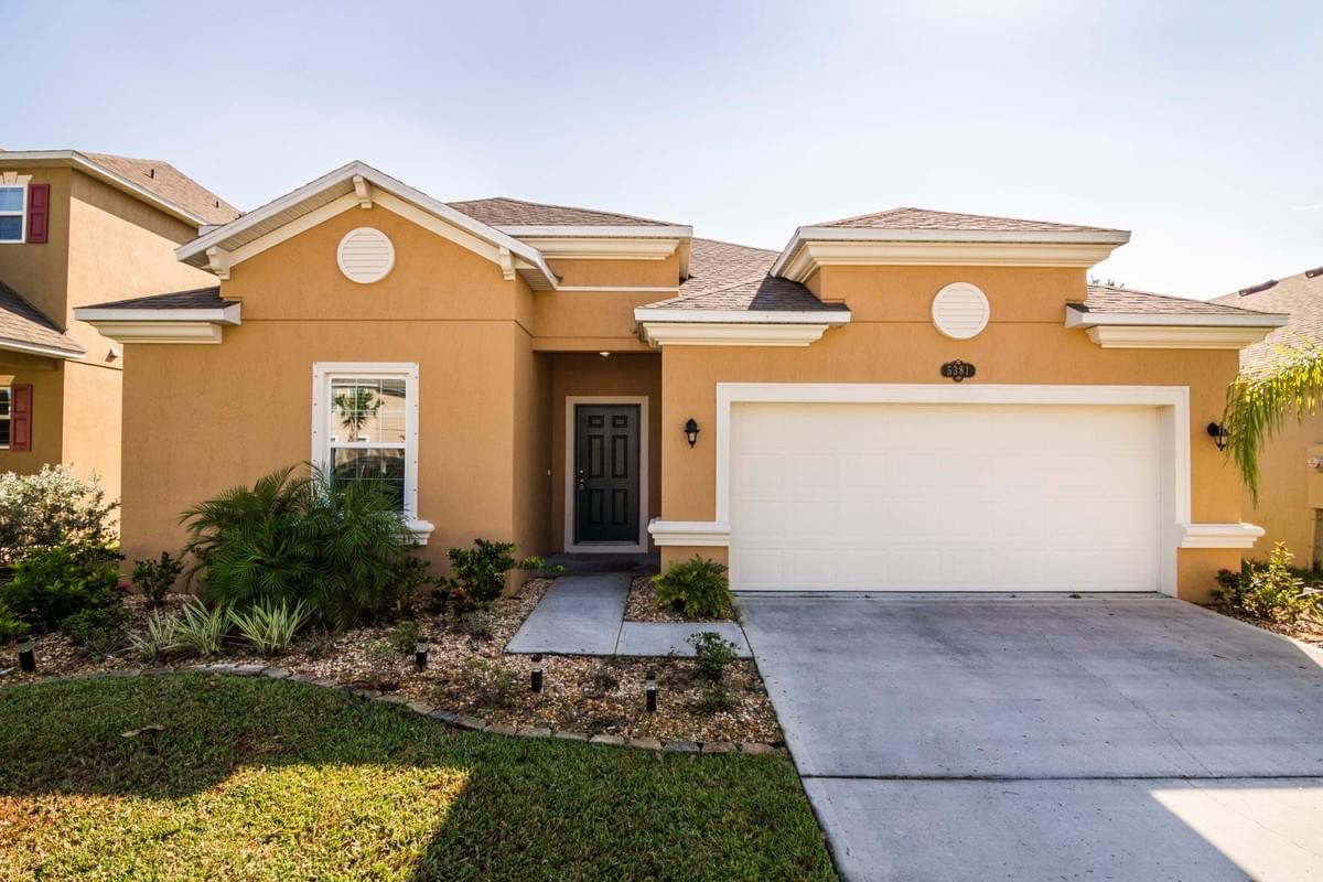 rust colored single story home with white trim rust colored single story home with white trim