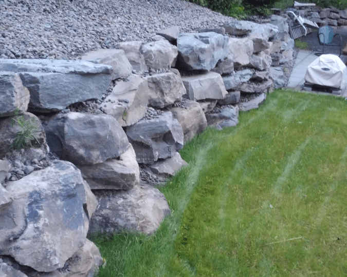 Boulder retaining wall installation. Retaining wall company. Well built beautiful retaining wall Boulder retaining wall installation. Retaining wall company. Well built beautiful retaining wall