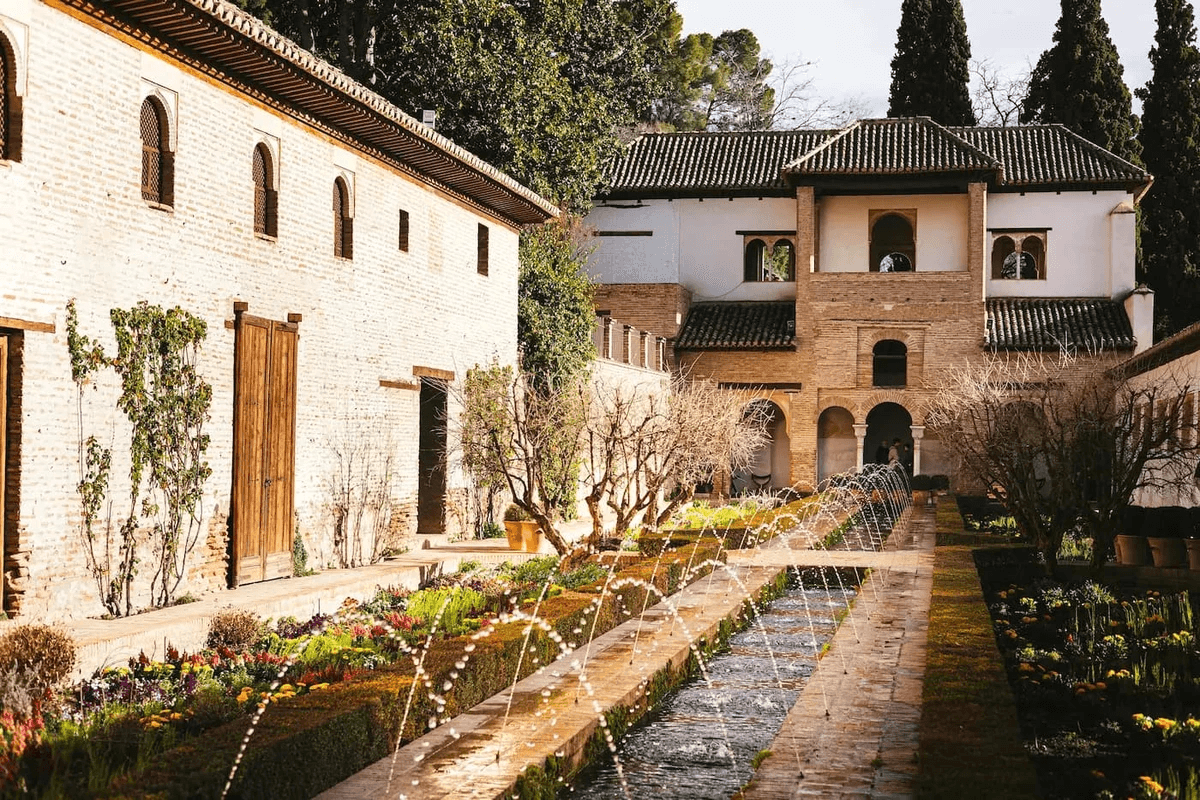Andalusian courtyard with fountain reflecting Islamic architectural heritage in Málaga Andalusian courtyard with fountain reflecting Islamic architectural heritage in Málaga