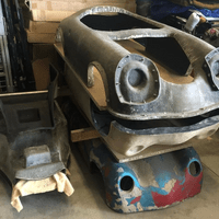 Cockpit molds on the left. Original body sculpture on the bottom right which was used to make the body molds on the top right.