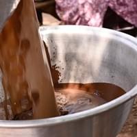 Pouring ground shea paste