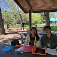 Lab manager Alix and developmental science area grad student Jihyun running experiments in Look Park