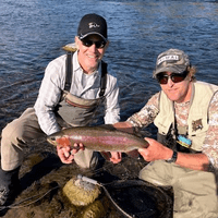 Taupo fly fishing guide displays a nice rainbow trout