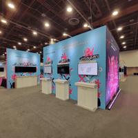 Cisco Emerging Technologies and Incubation Booth @ Kube Con 2022 demo stations and back wall