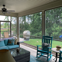 Screened porch with chairs