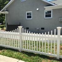 Scalloped White Vinyl Fence