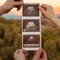 Couple holding ultrasound