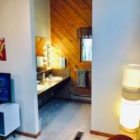loft bath with hotel-style vanity, separate from toilet and shower