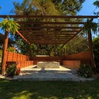 Pergola with built in benches and fire pit