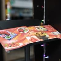 Copper Chimney menu displayed outside with a variety of dishes