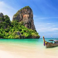 Enjoy an Island-hopping boat trip with limestone karsts, turquoise lagoons, snorkelling reefs