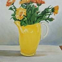 Calendulas in a yellow jug