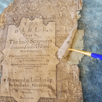 separating previously glued title page in a bath