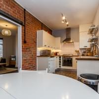 Wall stripped to brick and sealed, all decor, painting and kitchen.
