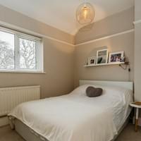 Small bedroom wallpapered and painted. Original features and fireplace restored.