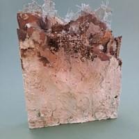 "Before the agony: the sprit grows" - relief of plaster and found materials, affected by fire and attrition