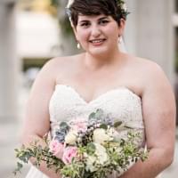Bride holding succulent and flower bouquet