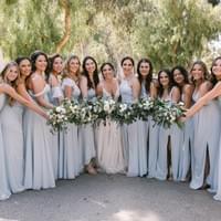 Large bridal bouquet with bouquets featuring white flowers and greenery