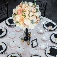 Classic black white and blush wedding decor, table display, with tall centerpiece
