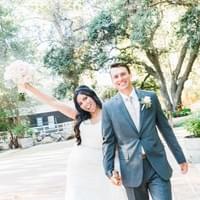 Happy bride and groom featuring classic white bridal bouquet