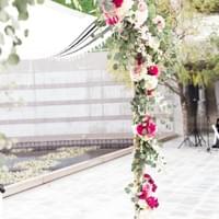 Chuppah at Skirball Cultural Center with white and pink floral and greenery