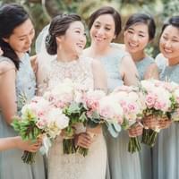 Bridal party with white and blush bouquets