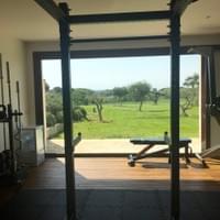 The gym opens onto the olive grove