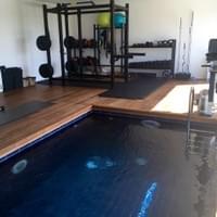 Gym features a contra flow heated swimming pool