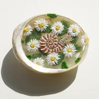 Stitching Time and Sea: Daisies and Anmonite