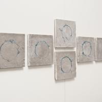 Undone, indigo dyed cotton, concrete, fine silver leaf