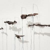 Held in knots, Bronze, needles, indigo dyed cotton