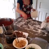 Acorn flouring the counter before we roll out the dough