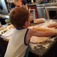 Cyrus rolling out stromboli dough!