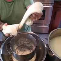 Stretching out our homemade mozzarella cheese