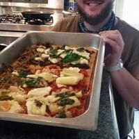 Winter proudly displaying the pizza we crafted together