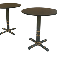 Pair of cast iron guéridons, of Neoclassical inspiration circa 1925. Black slate tops. 