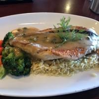 Snapper filet w/ rice pilaf and butter lemon sauce