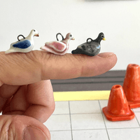 Porcelain pigeon charms