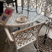 $595 cast aluminum table and six chairs