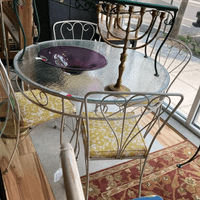 $295 white metal glass top table and 4 chairs