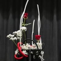 Ichiyo School containers, plastic tubing wrapped in red and black cord, painted mitsumata, baby’s breath, roses