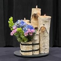 White birch candles holders and vase wrapped in black cord, candles, bells of Ireland, hydrangea, tiny mums