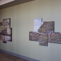 Riverview Main Entry, two relief sculpture wall works